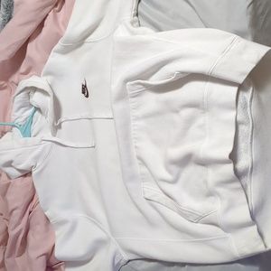 A white Nike sweatshirt with the brown logo on the upper right chest, no stains